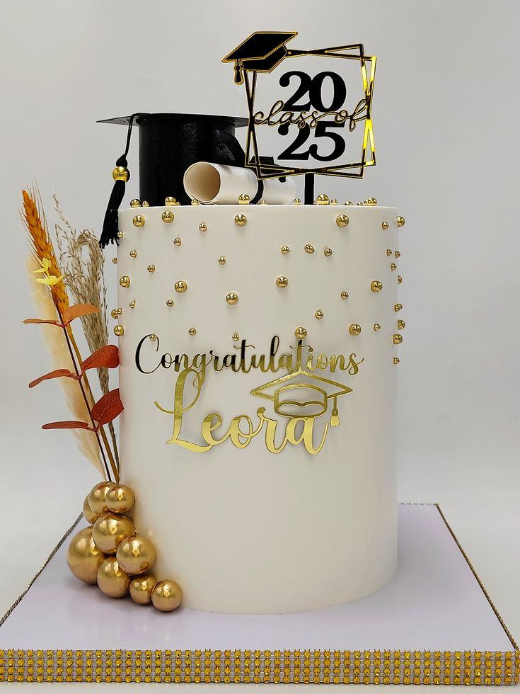 Gold and white graduation cake